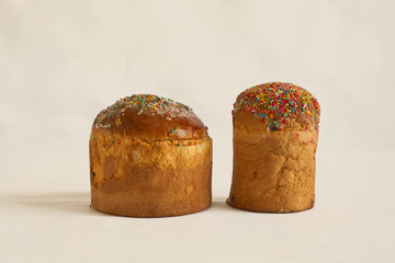 Two delicious Easter cakes on the table. White background.