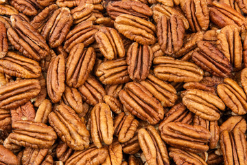 Pecan nuts close view as a background