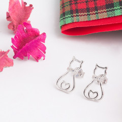 A pair of beautiful 925 sterling silver earrings in cat shape decorated with cubic zirconia