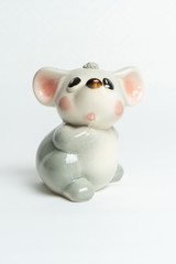 gray piggy bank toy made of porcelain or glass mouse
