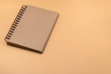 spiral notebook on Brown background