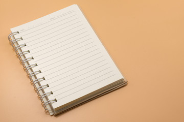 spiral notebook on Brown background