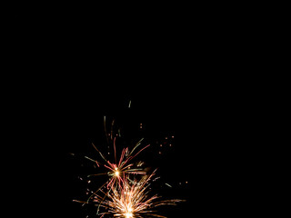 Colorful fireworks on the black sky background.