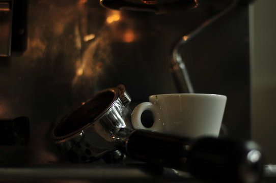 Darkened Picture With Stylish Light On Screen Carrier Coffee Machine And Espresso Cup