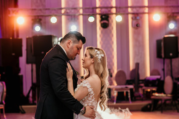Beautiful wedding couple dancing on their wedding. beautiful blonde girl and handsome groom