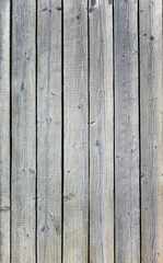 Backgroud of aged natural light old wood fence texture. Vertical orientation. Top view