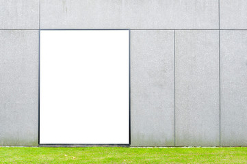 Blank white advertising billboard on the wall