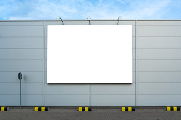 Blank white advertising billboard on the wall