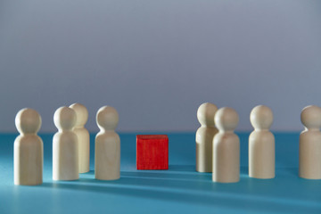 Wooden figures and red cube mockup template. Persons miniatures, bright block in center, copy space for creative design