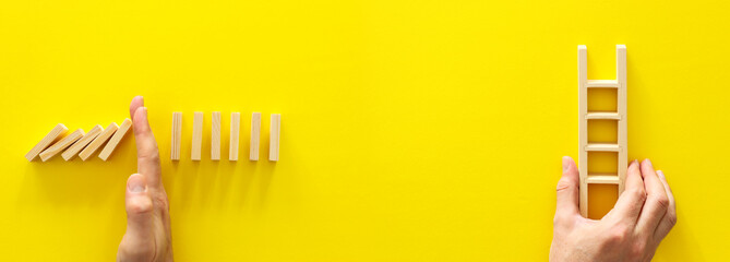 concept image of crisis and opportunity. domino effect versus ladder