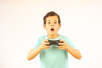 Fototapeta premium Handsome boy playing with a command