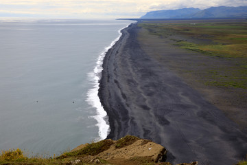 Vik / Iceland - August 15, 2017: The volcanic beach view from Dyrholaey promontory, Vik, Iceland, Europe