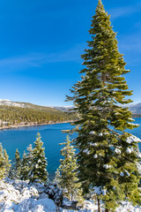 The Lake Tahoe, panorama of a mountain lake in winter, sunny day
