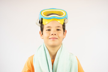 Smiling boy on summer vacation with towel