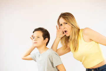 Mother and son making listening gesture