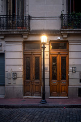 Doors lit by street lamp
