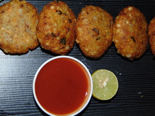 Sago fried patties served with tomato ketchup