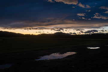 Dramatic cloudscape over fields