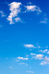 Naklejka na ściany i meble bright fluffy clouds on the blue sky. wonderful nature background in summertime