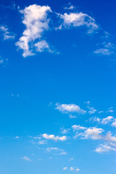 bright fluffy clouds on the blue sky. wonderful nature background in summertime