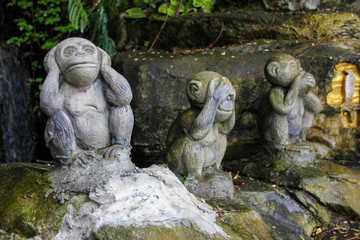 Fototapeta na wymiar Stone monkeys covering their ears, eyes and mouth resembling whats up icon