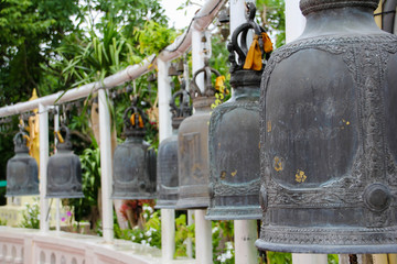Bells in the Golden Mountain Temple of Bangkok and with background vegetation