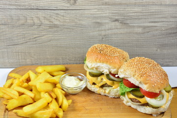 American cheeseburgers with fries and mayonnaise