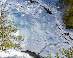 Wonderful Winter Landscape with snow and green trees blue sky at Sunny Day.