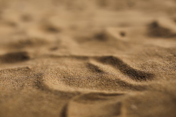 Fototapeta na wymiar Close up Nature Beach Sand Soft Texture In Summer. selective focus