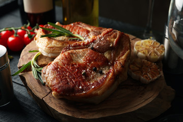 Composition with fried steaks and wine. Grilled food