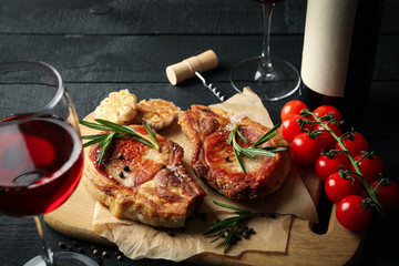 Composition with fried steaks and wine. Grilled food