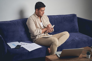 Male freelancer jotting down his ideas on paper