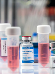 Coronavirus covid-19 experimental vaccine in a laboratory, conceptual image
