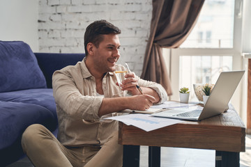 Man under quarantine drinking a healthy beverage