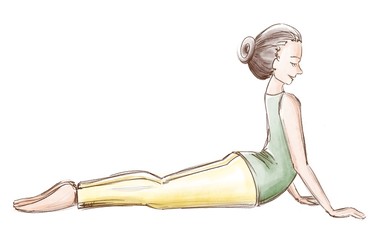 Yoga. The girl is lying in position of a snake