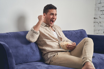 Male sitting before his computer at home