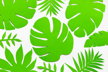 Concept hello summer with palm tree leaves. Paper art. Top view background. Flat lay. copyspace.