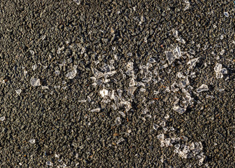 broken glass on asphalt 