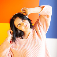 the girl in the headphones listens to music, concept of online media content service