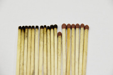 Matches new and burnt, with one saving others, symbolizing virus pandemic.