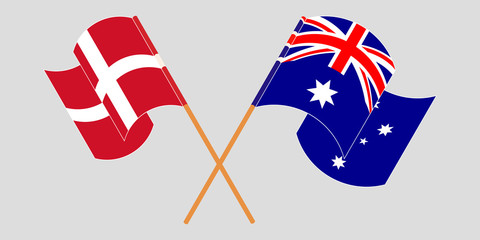 Crossed and waving flags of Australia and Denmark