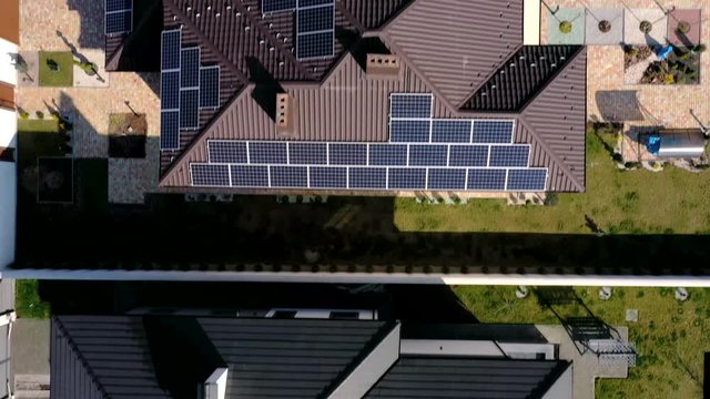 New House with garden and solar panels on the roof