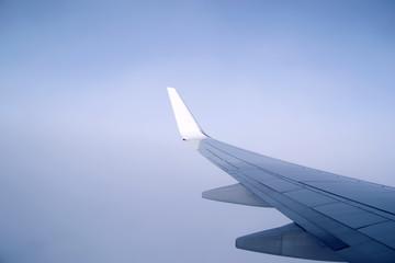Airplane wing. Flight in the sky.