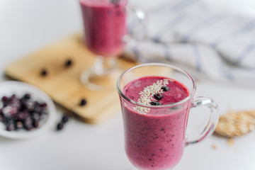 delicious berry smoothie on a wooden Board on a light background