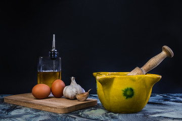 Bowl of garlic oil with eggs, garlic and oil