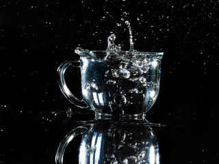glass mug with berry splashing in