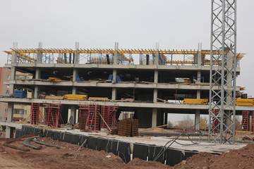 construction site with crane and scaffolding
