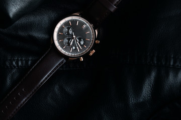 Gold LEATHER WATCH, VINTAGE STYLE WRIST WATCH, MEN'S LEATHER WATCH on leather background blur.