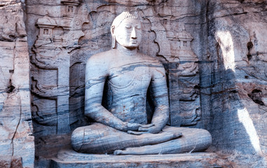 Buddha Sitting granite rock background in Gal vihara Polonnaruwa in Sri Lanka