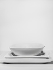 Fototapeta na wymiar white ceramic dishes on white background